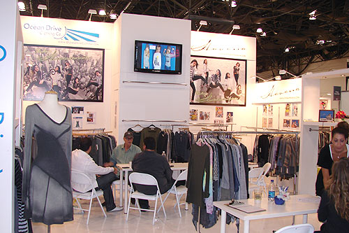 Hardwall trade show booth designed by Manny Stone Decorators